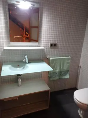 a bathroom with a sink and a mirror and a toilet at CA PEPICA in Anna