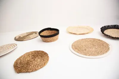 a group of straw hats on a white background at Jamaica Beach House in Puebla de Farnals