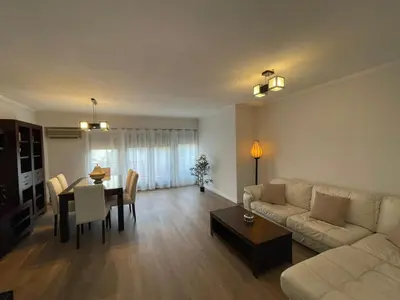 a living room with a couch and a table at Jardines del Turia in Valencia