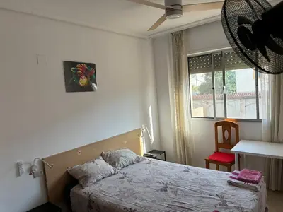 a bedroom with a bed and a window at CA LAU in Burriana