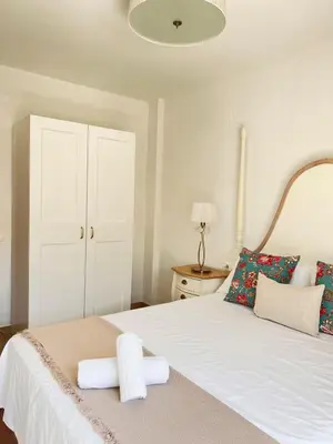 a bedroom with a bed with two towels on it at Majestic Flats in Valencia