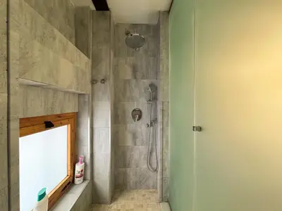 a bathroom with a shower with a glass door at Duplex en el Carmen 2 in Valencia