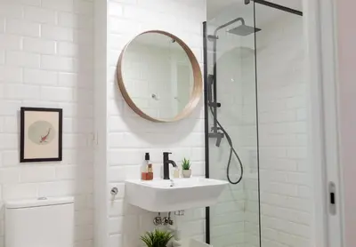 a white bathroom with a sink and a mirror at NC - Design Loft Steps from City of Arts & Sciences in Valencia