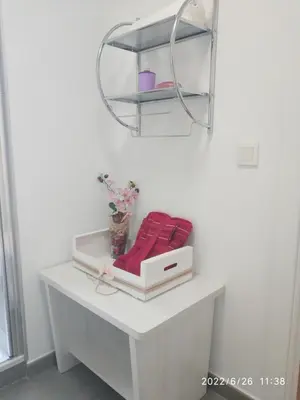 a white table with a shelf and a box on it at Bonito apartamento con piscina cerca de la playa. in Canet de Berenguer