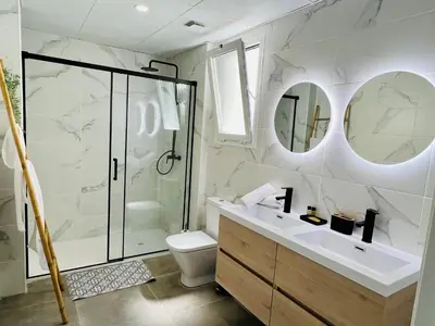a bathroom with a shower and a toilet and a sink at COOL LOFTS ALAMEDA VALENCIA in Valencia