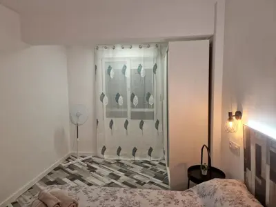 a bedroom with a shower with a bed in it at Selena Beach in Cullera