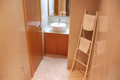 a bathroom with a sink and a towel rack at City Centre Room in Valencia