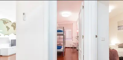 a bedroom with pink walls and a room with a bed at Apartamento Centro Histórico Valencia de 2 habitaciones in Valencia