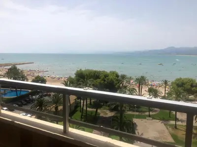 a view of the beach from the balcony of a resort at Cullera - Florazar II con piscina, tenis y club social in Cullera