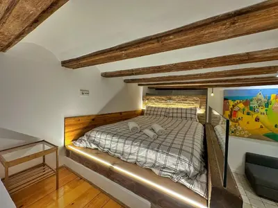 a bedroom with a bed with a glass wall at Dulces Sueños Pilar in Valencia