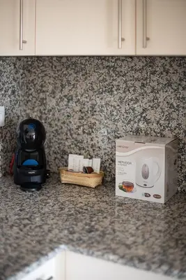 a microwave sitting on a counter next to a box at Nuevo apartamento en playa con aire acondicionado MASBO 3 in Moncófar