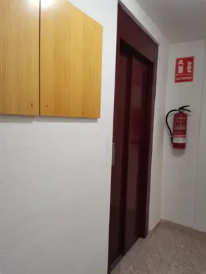 a room with a door and a cabinet at Acogedor apartamento en el grau de Moncofa con wifi in Moncófar
