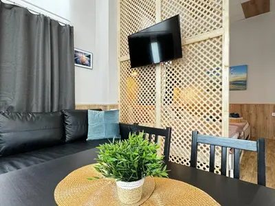 a living room with a table and a couch at Lliri 32 in Valencia