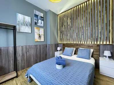 a bedroom with two beds with blue pillows at Salom 5 in Valencia