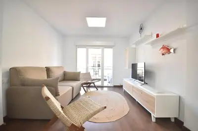 a living room with a couch and a tv at Gran piso en barrio historico del centro in Valencia