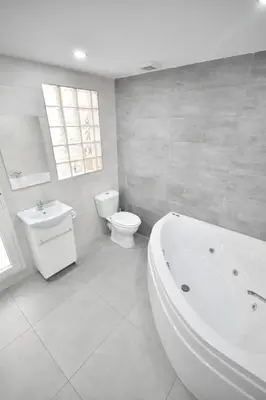 a white bathroom with a tub and a toilet at Gran piso en barrio historico del centro in Valencia