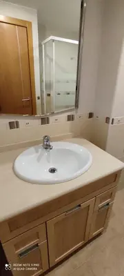 a bathroom with a white sink and a mirror at TU CASA en Benetússer , VALENCIA in Benetúser