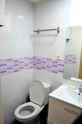 a bathroom with a toilet and a sink at Double cozy room. Ruzafa - perfect place to stay in Valencia