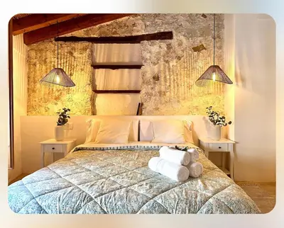 a bedroom with a bed with a teddy bear on it at ruralhome callemayor in Altura