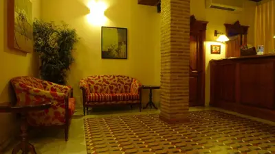 a living room with two chairs and a couch at Ad Hoc Monumental 1881 in Valencia