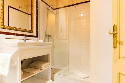a bathroom with a sink and a shower at Ad Hoc Monumental 1881 in Valencia
