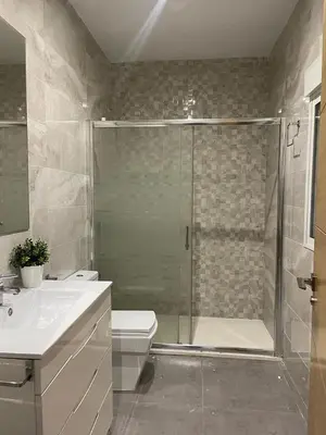 a bathroom with a shower and a toilet and a sink at UIM Mediterraneo PB Libertad Wifi in Puerto de Sagunto
