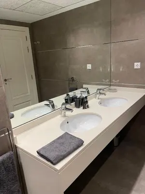 a bathroom with two sinks and a large mirror at PRIMERA LINEA PLAYA PATACONA, VALENCIA in Valencia
