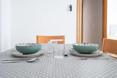 a table with two bowls on top of it at Excelente apartamento en 2ª línea de playa by Hometels in Puerto de Sagunto