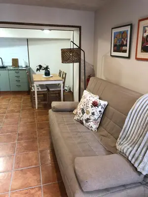 a living room with a couch and a table at Casa Puri in Jérica