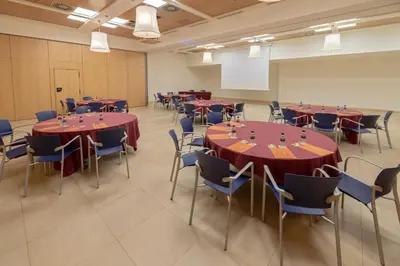 a conference room with tables and chairs in it at Silken Puerta Valencia in Valencia