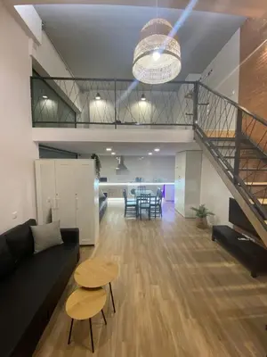 a living room with a couch and a table at Carbonell 1 in Valencia