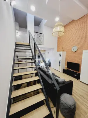a staircase in a living room with a couch at Carbonell 1 in Valencia