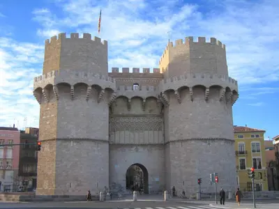 a large building with two towers on a city street at Hotel Albufera in Alfafar