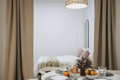 a dining room with a table with oranges on it at APARTAMENTOS LEO XIII in Valencia