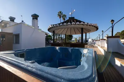 a blue tub sitting on top of a house at Villa Huerta 1 Manises, jacuzzi, sauna, piscina in Manises