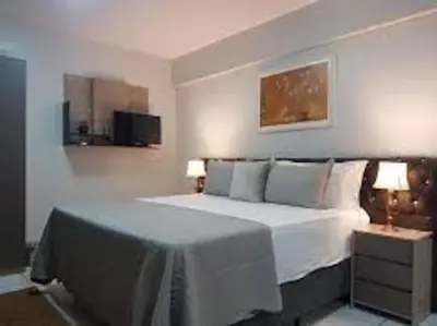 a bedroom with a large white bed and two lamps at amazing cozy apartment super central in Valencia