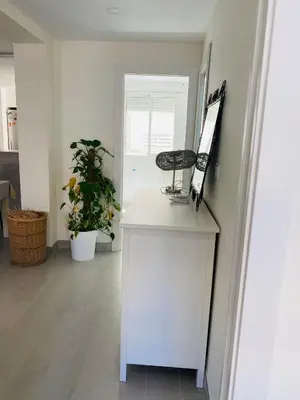 a room with a counter with a mirror and a chair at Apartamento Cuidad Ciencias in Valencia