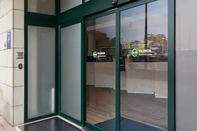 an entrance to a building with glass doors at B&B HOTEL Valencia Arena in Valencia