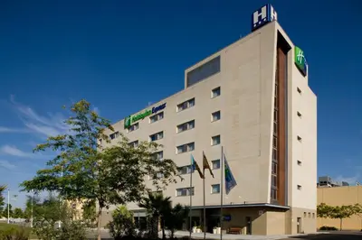 a hotel with a sign on top of it at Holiday Inn Express Valencia Bonaire by IHG in Aldaya