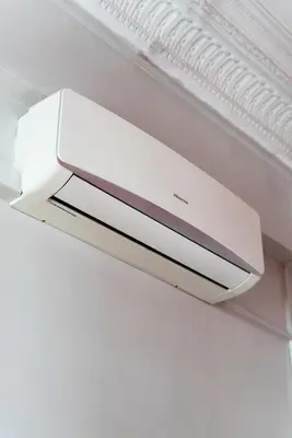 a white object hanging from the ceiling of a refrigerator at Red Nest Hostel in Valencia