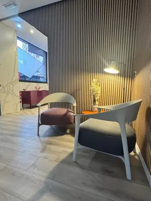 a room with a table and a bench and a chair at Hotel Mediterraneo Valencia in Valencia