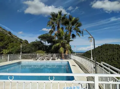 a swimming pool on top of a house at Villa Montgrau in Llano de Gorra