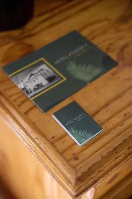 a wooden table with three cards on top of it at Hotel De Jerica in Jérica