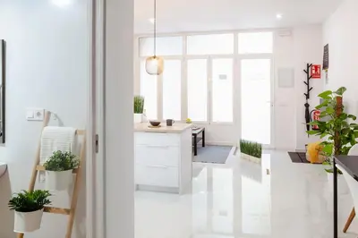 a kitchen with white walls and a white floor at Artistic Digital Retreat-Great Location Near Metro in Valencia