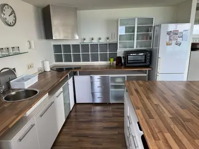a kitchen with white cabinets and a sink and a microwave at Spacious Apartment in Valencia with Sea View - 160 sqm in Valencia