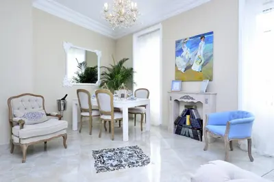 a dining room with a table and chairs and a fireplace at Joaquín Sorolla in Valencia