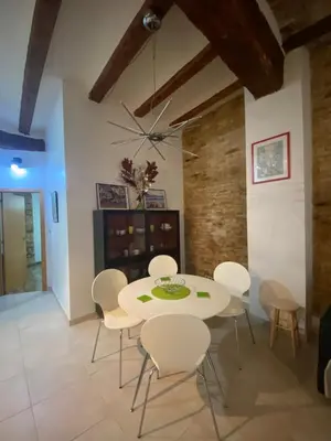 a dining room with a white table and chairs at Your Valencia Home in Valencia