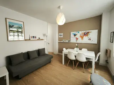 a living room with a couch and a table at FLORIT FLATS - The Ausias March Apartment in Valencia