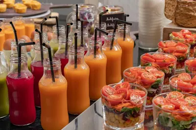 a bunch of bottles of orange juice on a table at Vincci Palace in Valencia