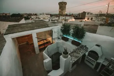 an aerial view of a building with a table and chairs at Preciosa casa-cueva con bañera in Paterna